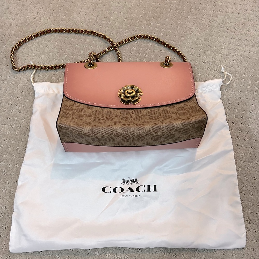 NWOT pink flowers Coach crossbody/shoulder bag, with original storage bag